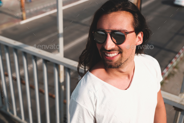 Attractive bearded man portrait wearing fashionable sunglasses - Stock Photo - Images
