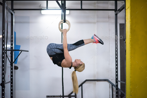 woman working out on gymnastic rings Stock Photo by dotshock | PhotoDune