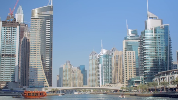 Amazing Panorama of Modern Skyscrapers on a Coasts of Fake Canal Against Clear Blue Sky