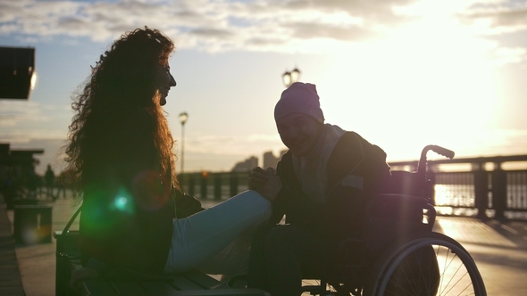 Young Disabled Young Man in a Wheelchair with Young Woman Enjoying the ...