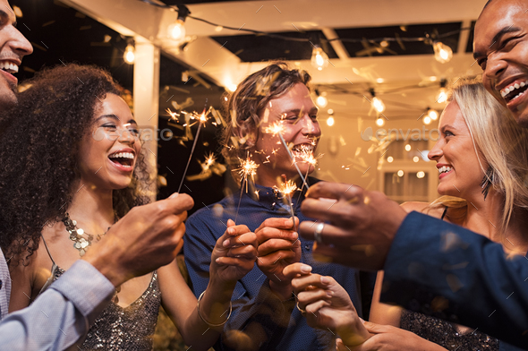 Friends celebrating new year's eve - Stock Photo - Images