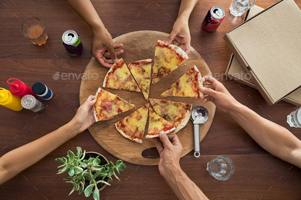 Friends enjoying pizza party Stock Photo by Rido81