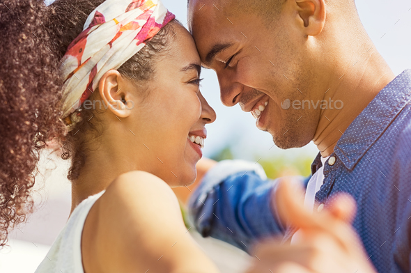 African couple looking at each other - Stock Photo - Images
