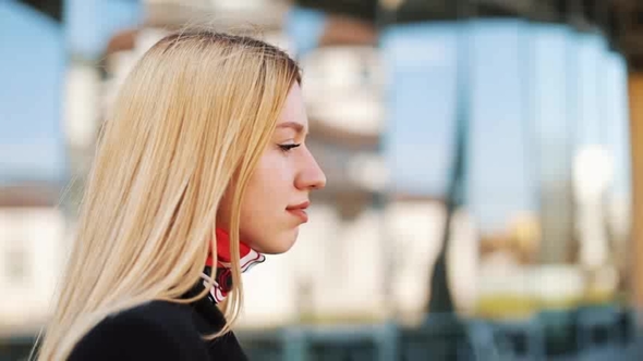 Stunning Young Woman Walks Straight Along the Mirror Wall Outside alt