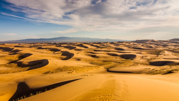 Sunset Over the Sand Dunes in the Desert alt