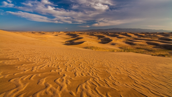 Sunset Over the Sand Dunes in the Desert alt