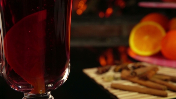Orange Slice Falls Into a Beautiful Mug of Mulled Wine alt