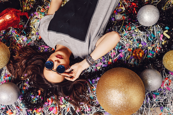 Glamorous party girl wearing sunglasses - Stock Photo - Images