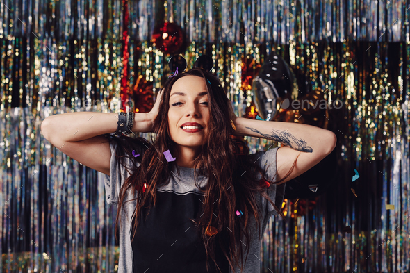 Portrait girl enjoying party and confetti - Stock Photo - Images