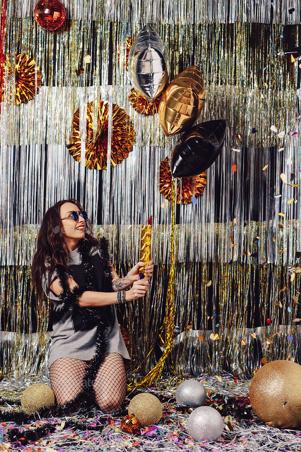 Portrait girl enjoying party and confetti - Stock Photo - Images