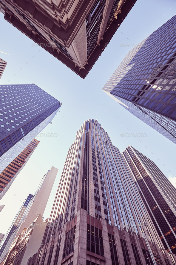 Looking up at Manhattan skyscrapers at sunset, NYC. - Stock Photo - Images