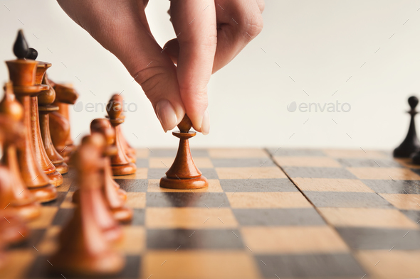 The white pawn chess piece is starting the game on chessboard Stock Photo -  Alamy