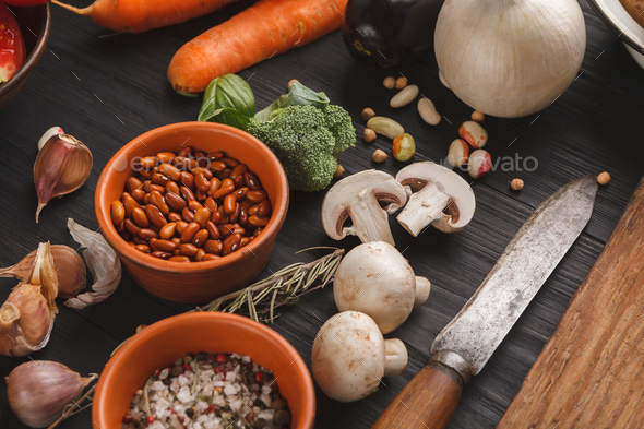 Fresh organic vegetables and wooden desk background - Stock Photo - Images