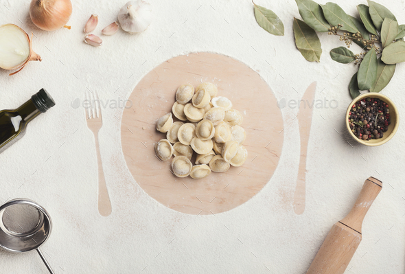 Dumplings on the table with flour, layout for recipe - Stock Photo - Images