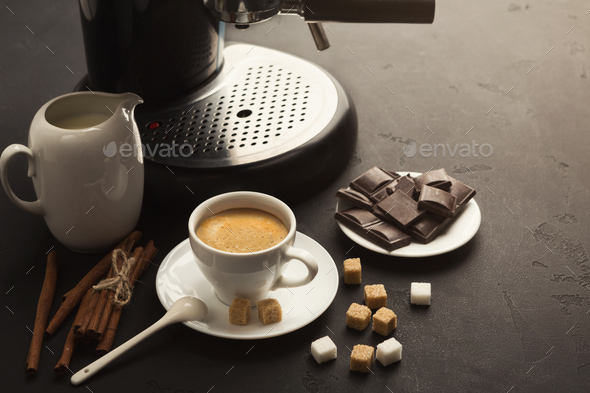 Coffee cup and sweets on black table - Stock Photo - Images