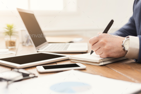 Unrecognizable businessman typing on laptop - Stock Photo - Images