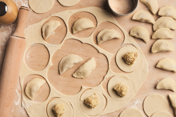 Preparing dumplings with potato, cooking russian food - Stock Photo - Images
