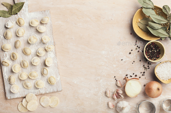 Dumplings on the table with flour, layout for recipe - Stock Photo - Images