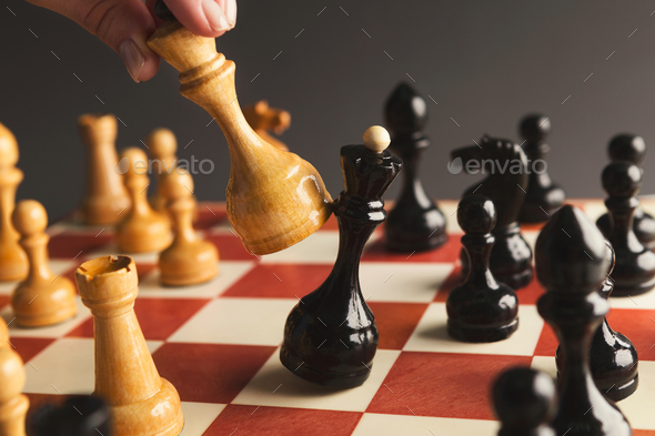 Hand of player chess board game putting white pawn Stock Photo by Prostock-studio