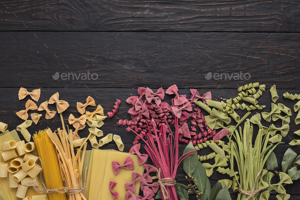 Various types of handmade pasta on black background - Stock Photo - Images