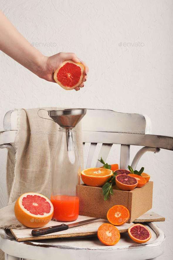 Preparing citrus fresh on white old chair - Stock Photo - Images