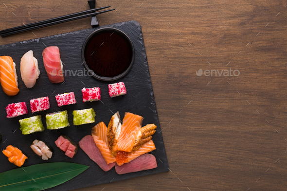 Set of assorted sushi, maki and rolls on rustic wooden background - Stock Photo - Images