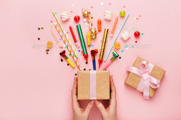 Birthday party background with gift and confetti - Stock Photo - Images