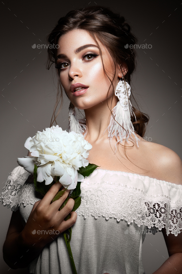 Glamour portrait of beautiful woman model with fresh daily makeup and romantic wavy hairstyle. - Stock Photo - Images