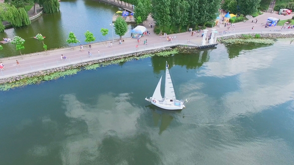 Aerial View Flight Over the Park and Beautiful Blue Lake in the City Center. Ternopil Ukraine