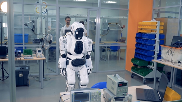 Man and Woman Check Robot Working alt