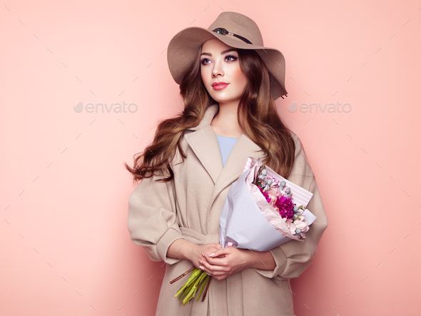 Brunette young woman in stylish greatcoat - Stock Photo - Images