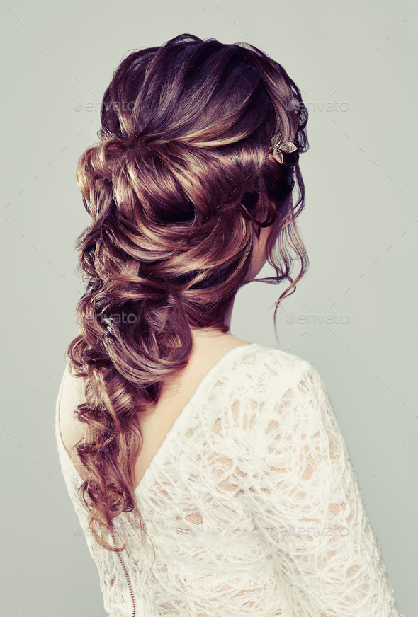 Brunette woman with long and shiny curly hair - Stock Photo - Images