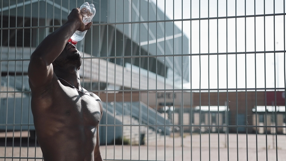 Black African American Male Athlete After Hard Training Drinking Clean Cool Water alt