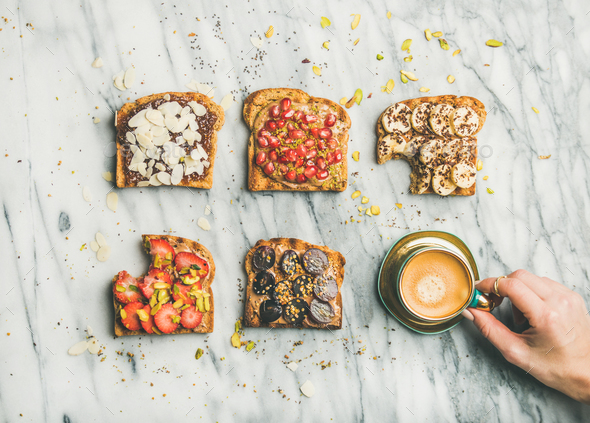 Healthy breakfast with wholegrain toasts , coffee over grey marble background - Stock Photo - Images