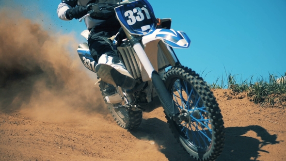 Pilot of an FMX Bike Is Performing a Sharp Turn alt