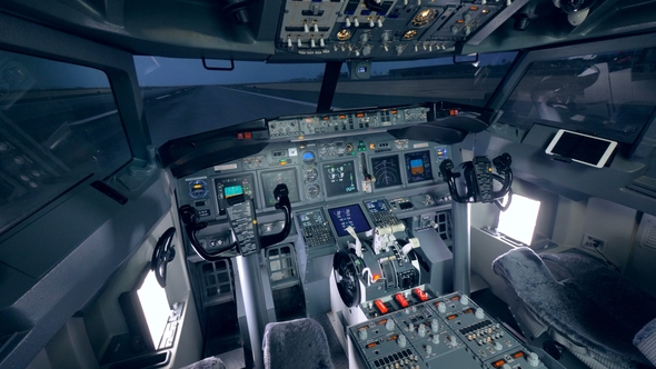 Detailed Footage of a Cockpit of a Plane Which Is Standing on a Take-off Runway alt