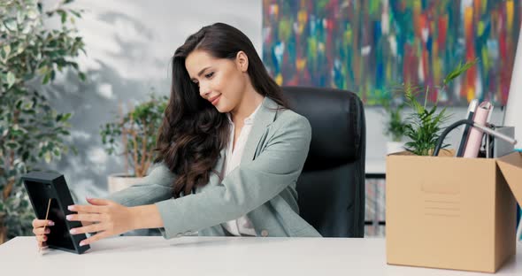 Ambitious New Employee in Company Takes Seat at Desk in the Office ...