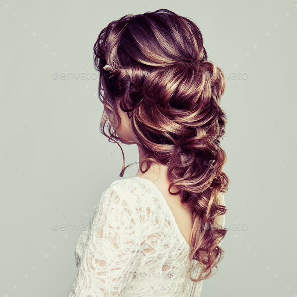 Brunette woman with long and shiny curly hair - Stock Photo - Images