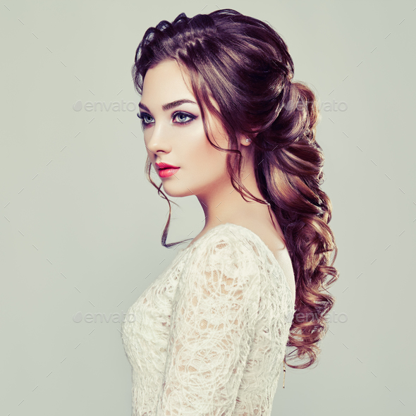 Brunette woman with long and shiny curly hair - Stock Photo - Images