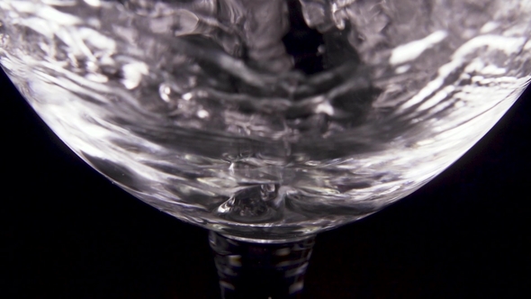 Pour Transparent Water Into a Transparent Glass