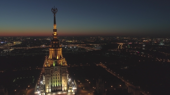 Illuminated Moscow State University and Cityscape in Morning Twilight. Russia. Aerial View alt