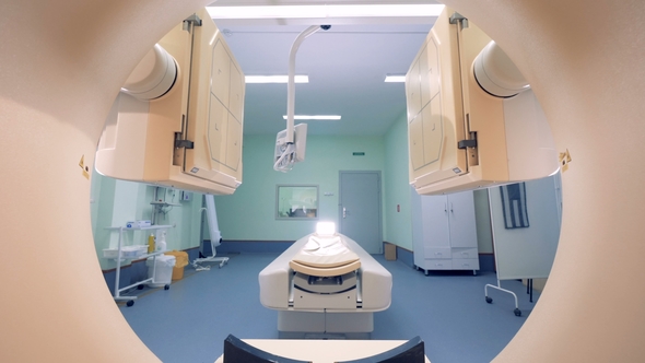 Lowering Scanning Platforms Seen Through a Target Ring of a CAT-scanner alt