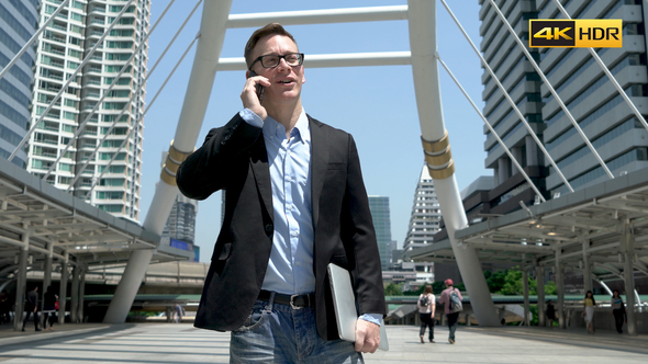 Entrepreneur Talking On Phone At Modern City