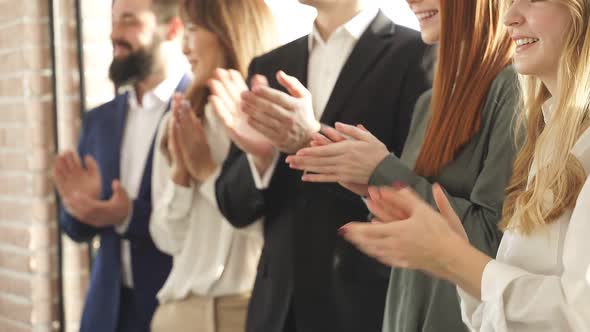 Mixed Race Team of Business Colleagues Clapping Hands