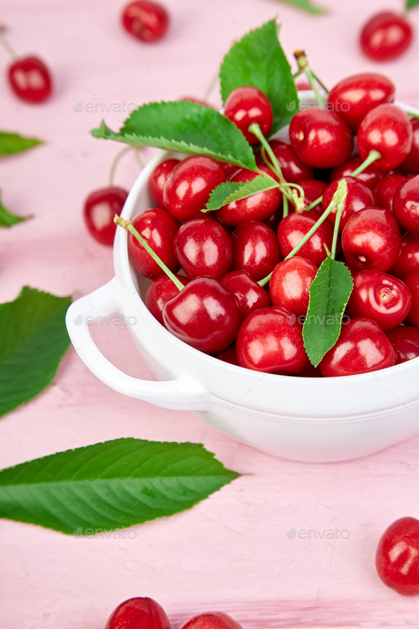 Red cherry in white bowl - Stock Photo - Images