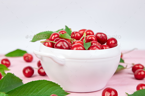 Red cherry in white bowl - Stock Photo - Images