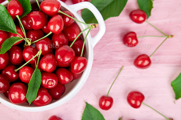 Red cherry in white bowl - Stock Photo - Images
