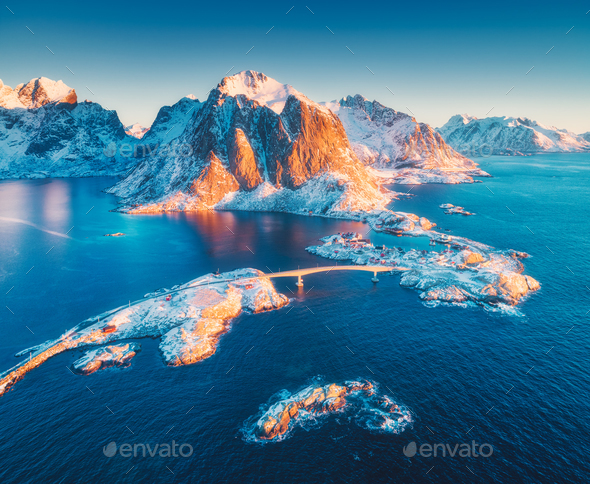 Aerial view of Reine and Hamnoy at sunrise in winter - Stock Photo - Images