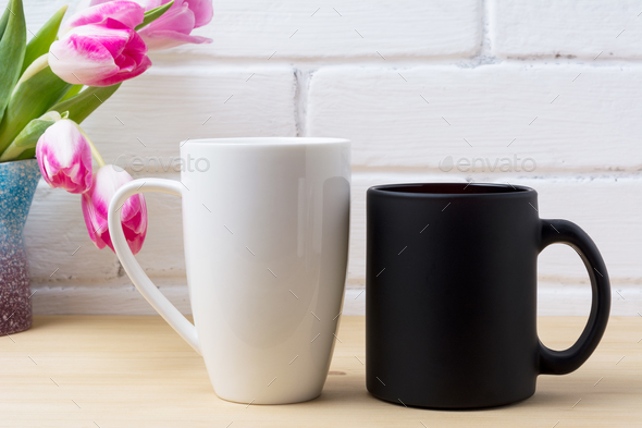 Black coffee cup and white cappuccino mug mockup with magenta tu - Stock Photo - Images