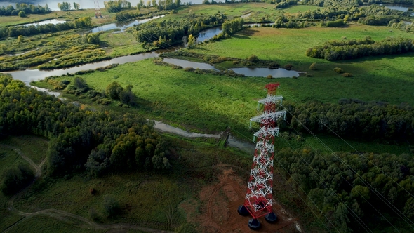Alternating Current Transmission Towers Above Green Fields alt